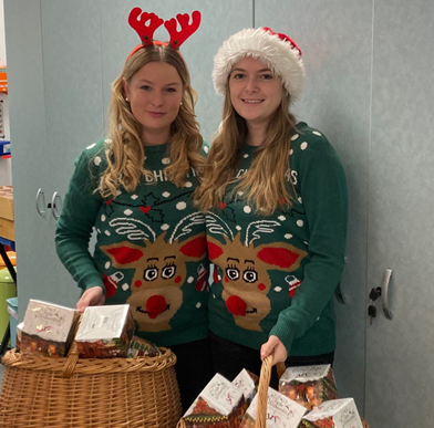 Christmas elves distribute Advent calendars to all employees